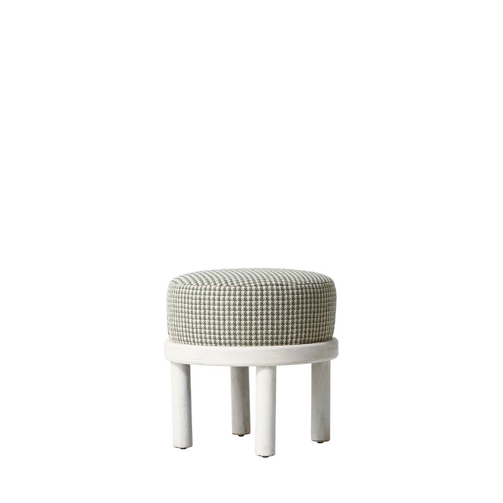 Small round stool with patterned cushion on a white background