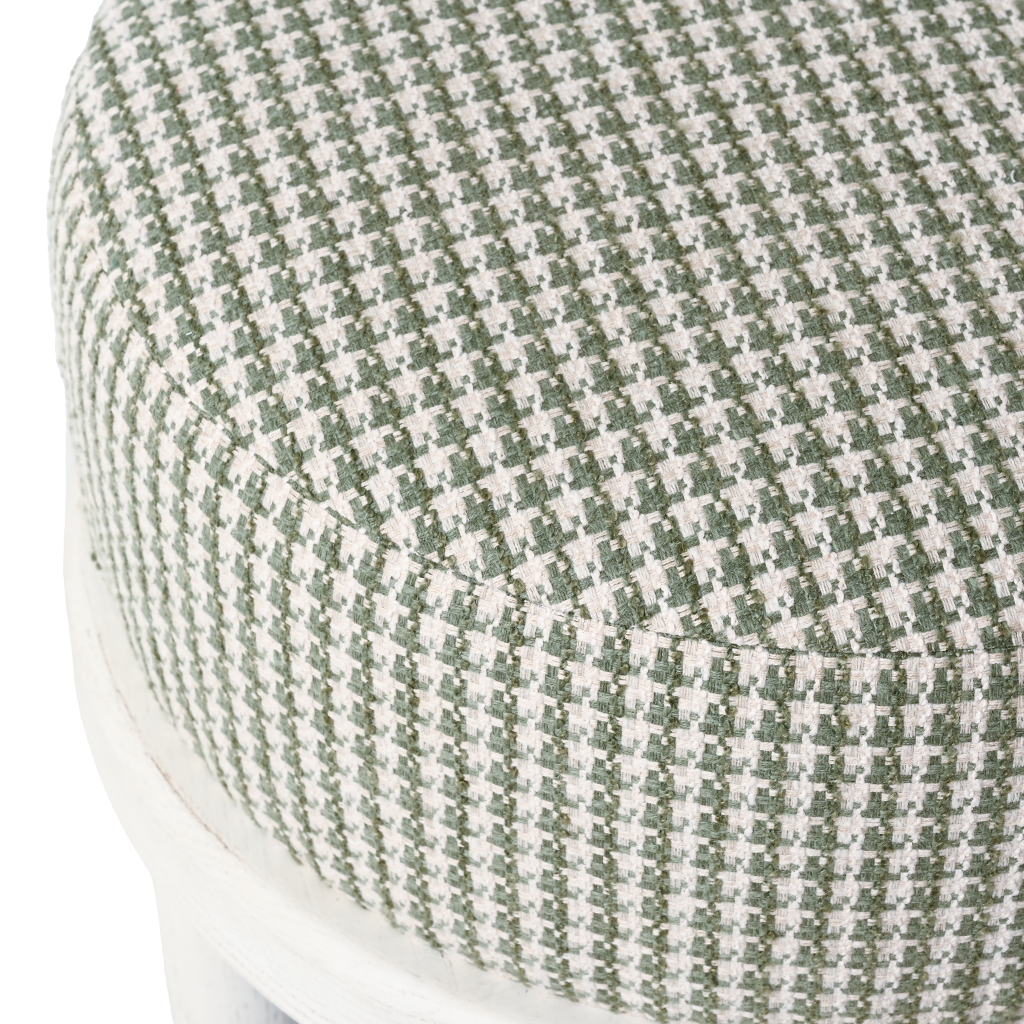 Close-up of a green and white checkered cushion on a chair.