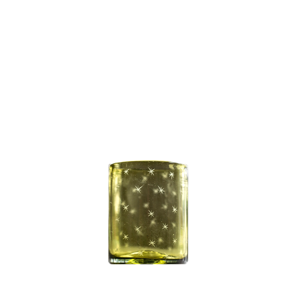 Yellow tinted glass tumbler with star-shaped etchings and a thick base.