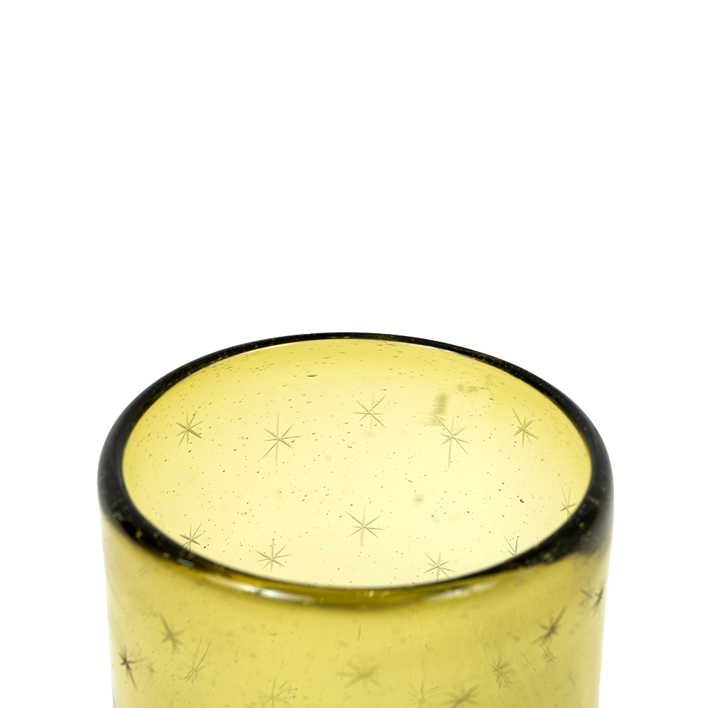 Yellow tinted Etoile rocks glass with subtle star patterns and a smooth rounded rim.