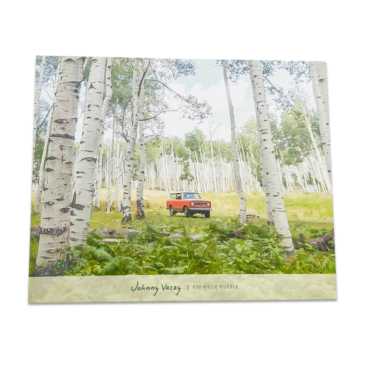 puzzle with red bronco car and trees