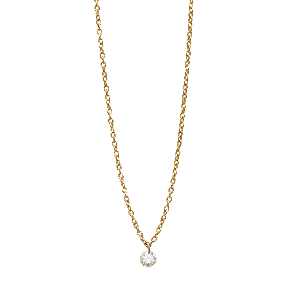 Gold necklace with a small diamond pendant on a white background