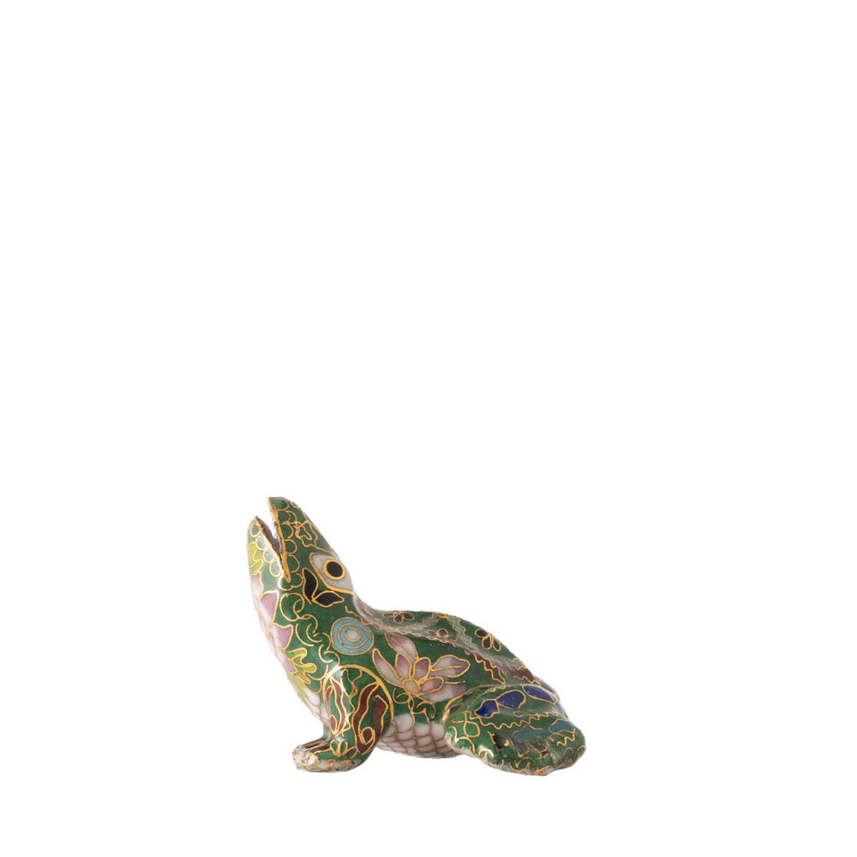 Decorative frog figurine with intricate patterns on a white background