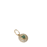 Gold pendant with a green gemstone on a white background