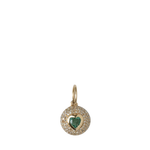 Gold pendant with a green gemstone heart on a white background