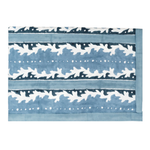 A rectangular textile featuring a blue and white ikat pattern with horizontal bands of abstract motifs and dotted lines.