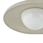 Close-up of a modern ceiling light fixture with a wide, shallow round shade in a warm beige tone and a frosted white glass globe bulb in the center, isolated on a white background.