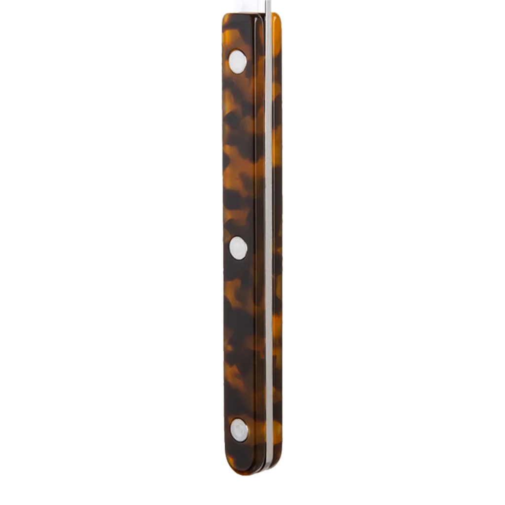 Tortoiseshell patterned handle on a white background
