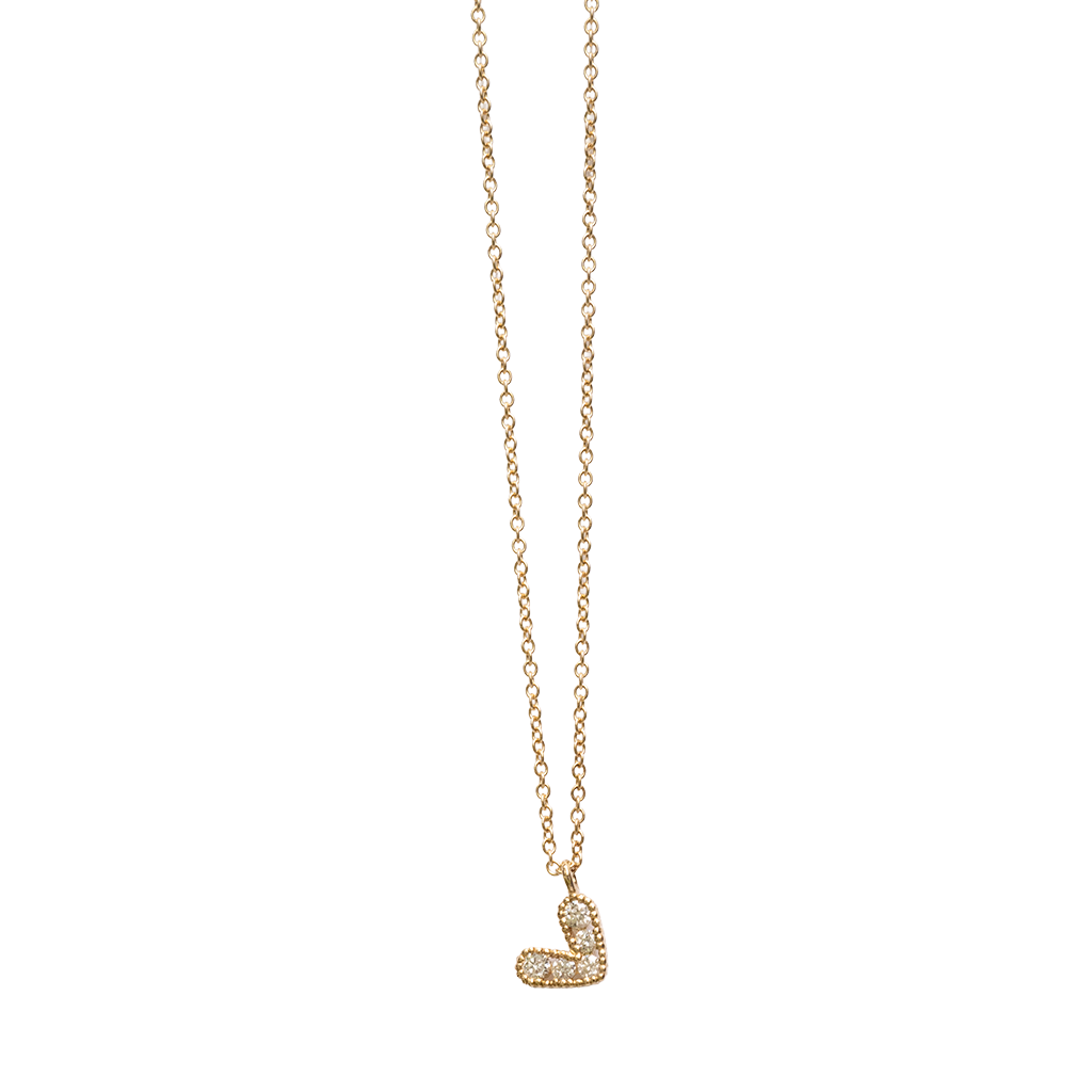 Gold heart necklace on a white background