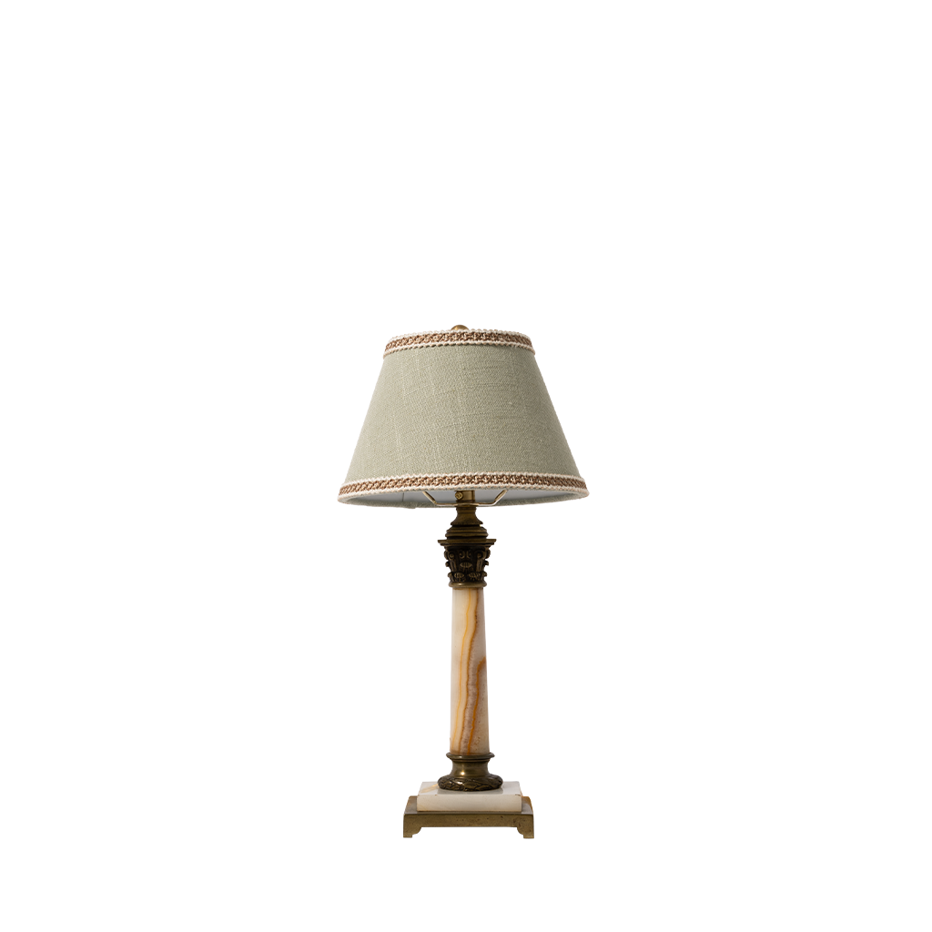 Small lamp with a decorative shade on a white background
