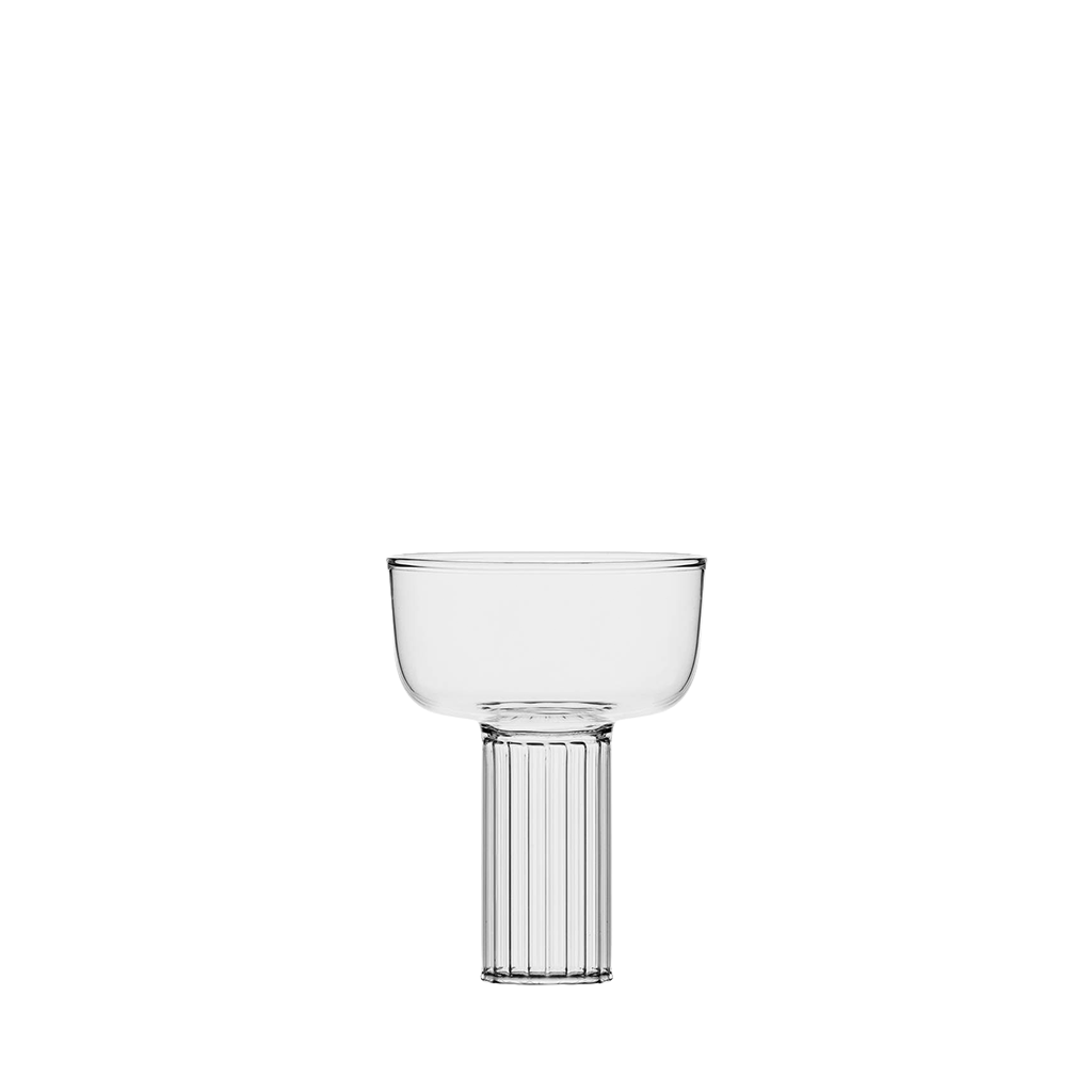 Clear champagne coupe with ribbed base on a white background