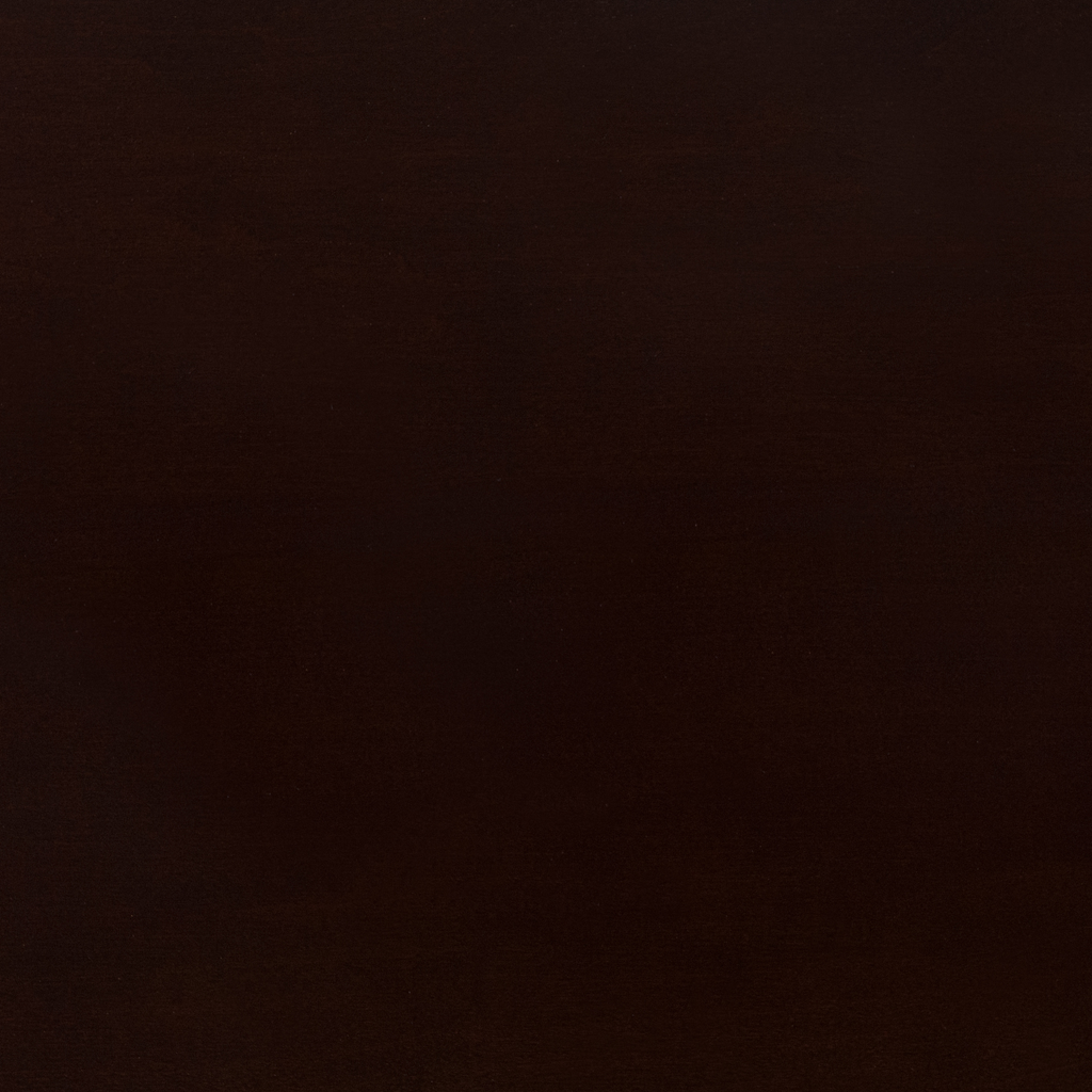 A close up photo of a round table top in walnut veneer, finished in a deep brown