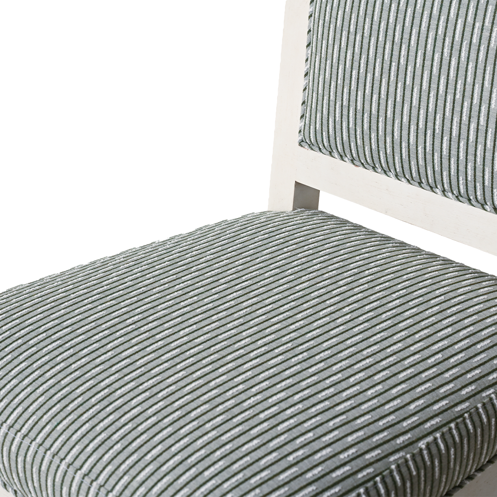 Close-up of a chair with striped gray cushion on a white background