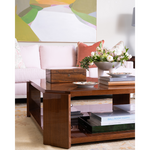 Wooden coffee table with decorative items in a living room setting