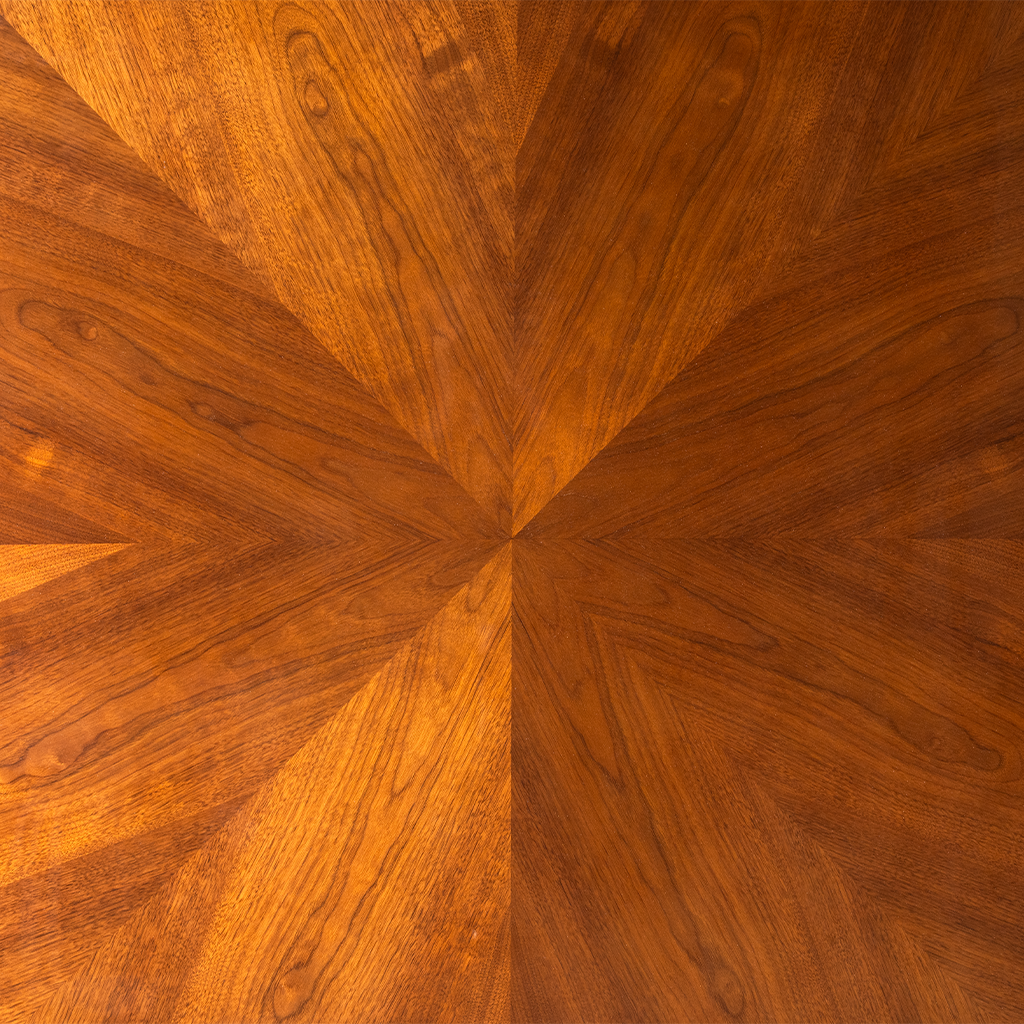 Close-up of a wooden surface with a starburst pattern