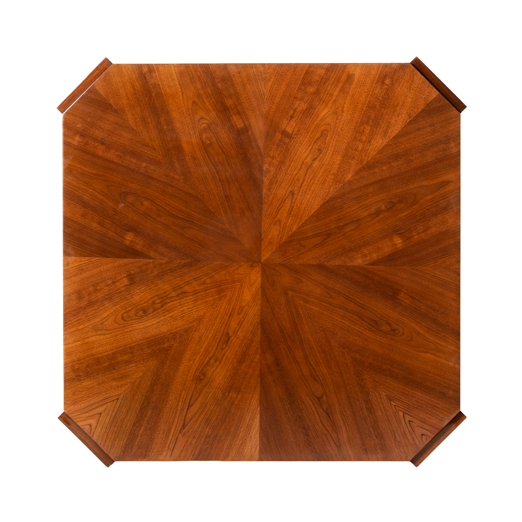 Wooden table top with a starburst pattern on a white background