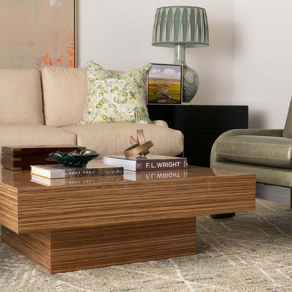 Rectangular wooden Carter Cocktail Table with horizontal grain, low profile, and layered base design.