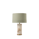 Table lamp with a marble base and green shade on a white background