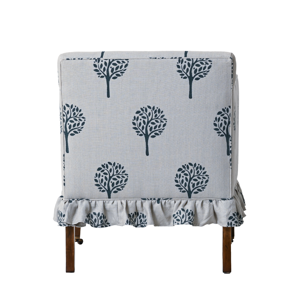 Chair with a gray cover featuring black tree patterns on a white background