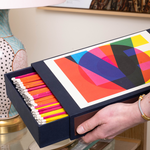 Giant matches in match box with word "LOVE" in colorful design.