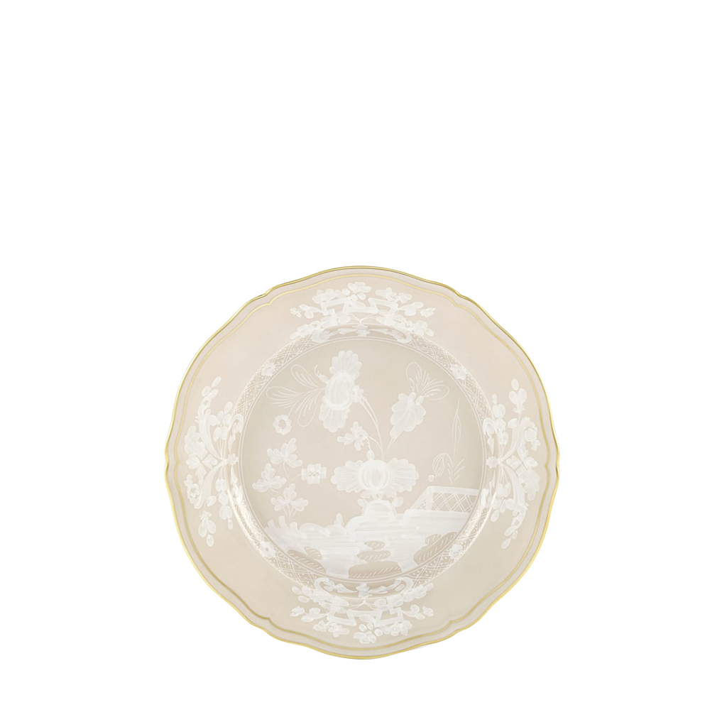 Round ceramic plate with textured surface on a white background