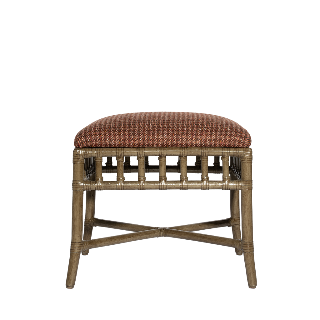 Wicker stool with a brown cushion on a white background
