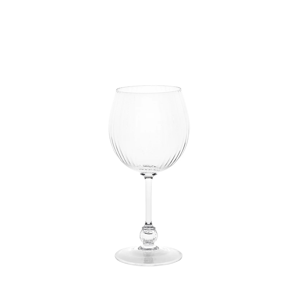 A clear glass wine glass with a wide, rounded bowl featuring vertical ribbed detailing, a slender stem, and a round foot, shown against a plain white background.