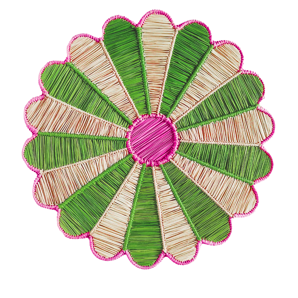 Decorative flower-shaped mat with green and beige petals and a pink center on a white background
