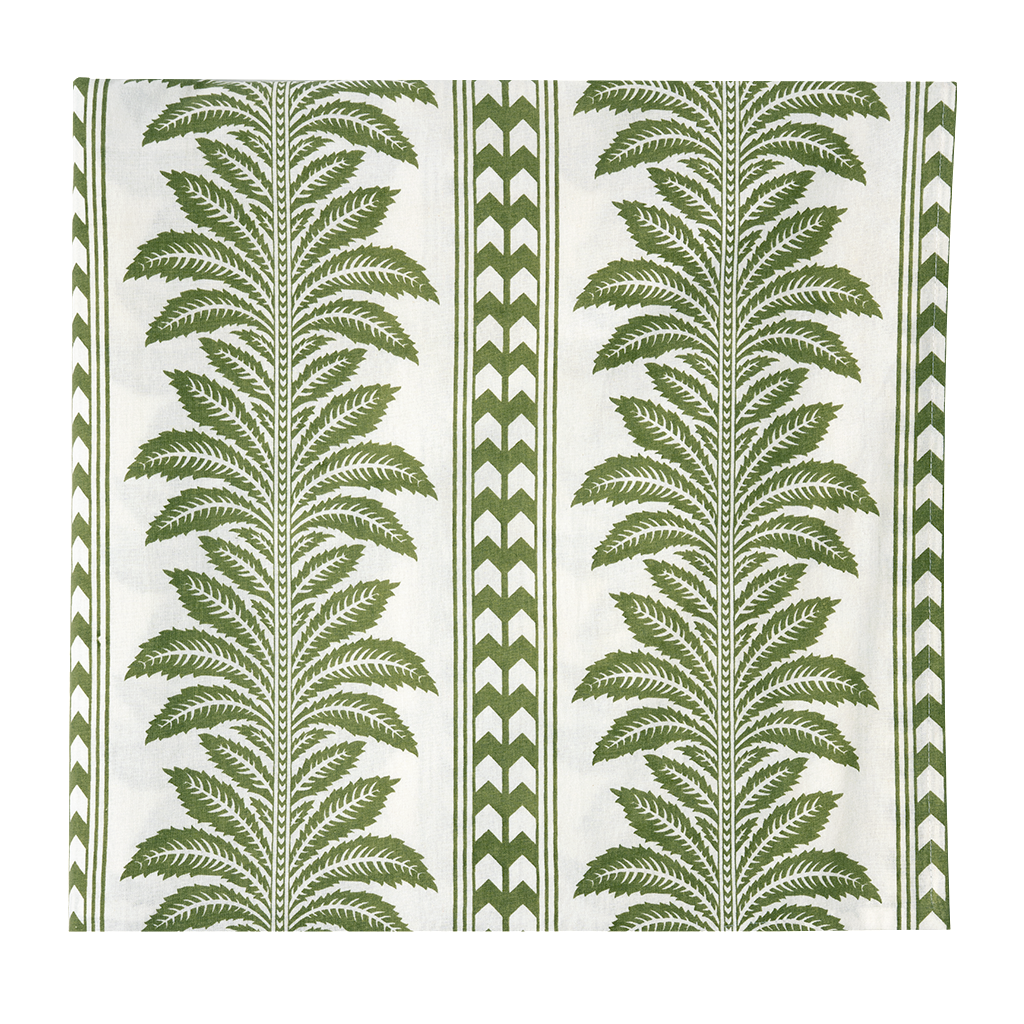 white tablecloth folded into a square with a green palm tree striped pattern on a white background