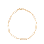 Gold bracelet with embedded stones on a white background