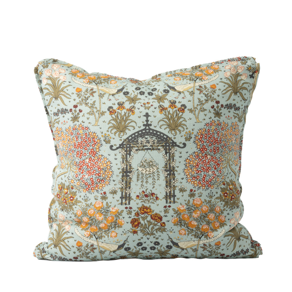 Colorful pillow with a pagoda-like structure, birds, flowers, and botanicals ona white background