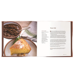 Open cookbook showing a recipe for Texas Chili with a side of cornbread.