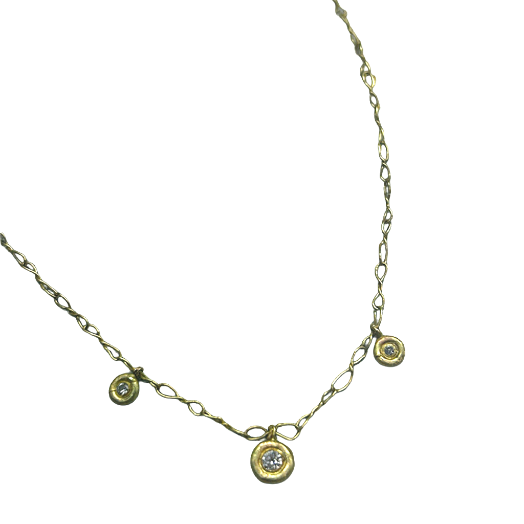 Gold necklace with small circular diamond pendants on a white background