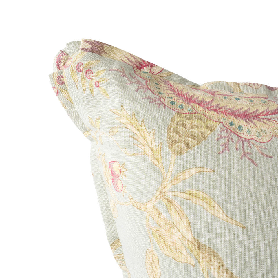 Close-up of a floral patterned fabric with pink and gold colors on a light background