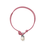 A pink braided cord bracelet with a knot closure and a dangling white pearl bead set in a silver-toned cap, shown on a plain white background.
