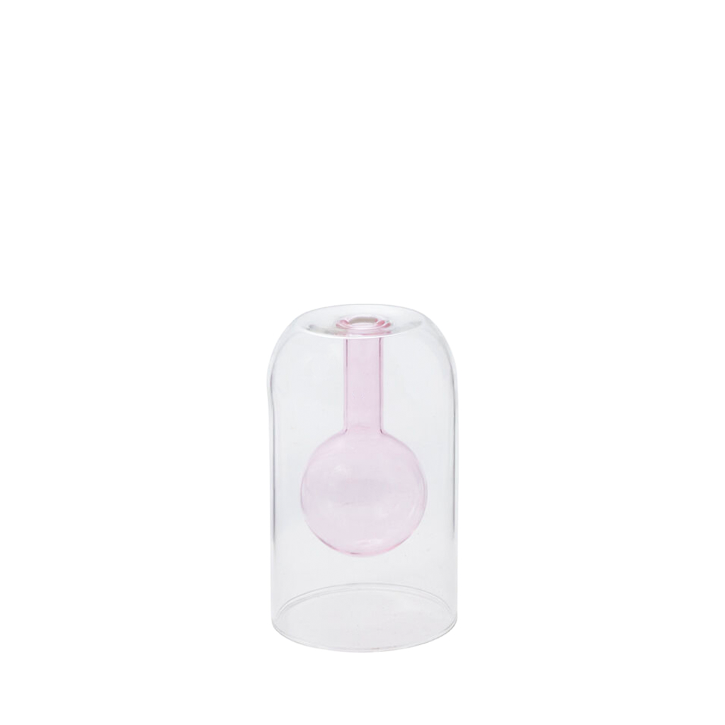 Clear glass vase with a pink interior on a white background