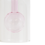 Pink glass orb on a white background