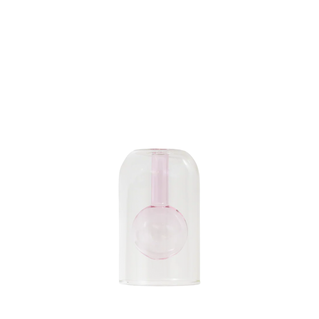 Pink glass vase in a clear plastic dome on a white background