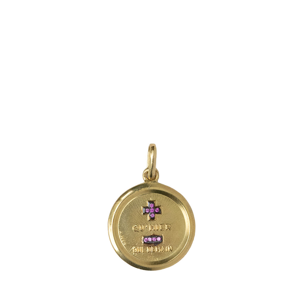 Gold pendant with pink gemstones on a white background