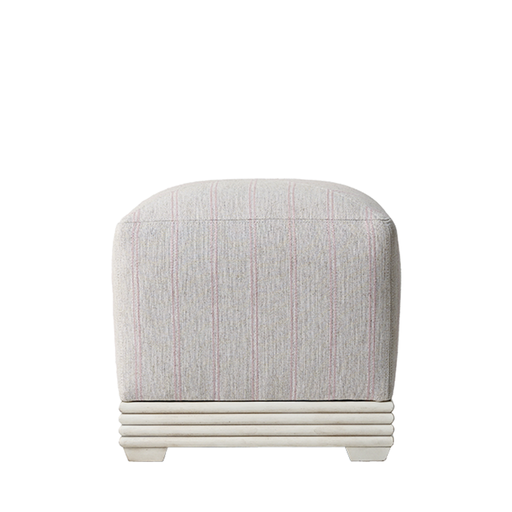 Gray upholstered ottoman with a white base on a white background