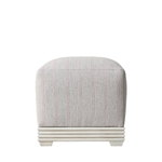 Gray upholstered ottoman with a white base on a white background