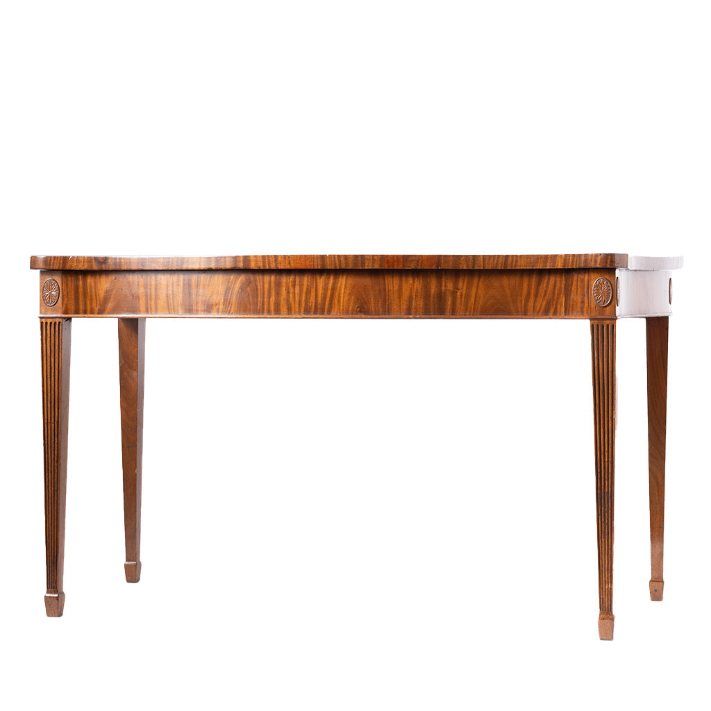 A mid-century wooden console table with a rich brown grain, fluted legs, and a white side drawer, shown against a plain white background.