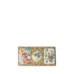 A rectangular Chinese porcelain plate with intricate hand-painted floral and landscape motifs, featuring a central oval scene and two side panels, set against a plain white background.