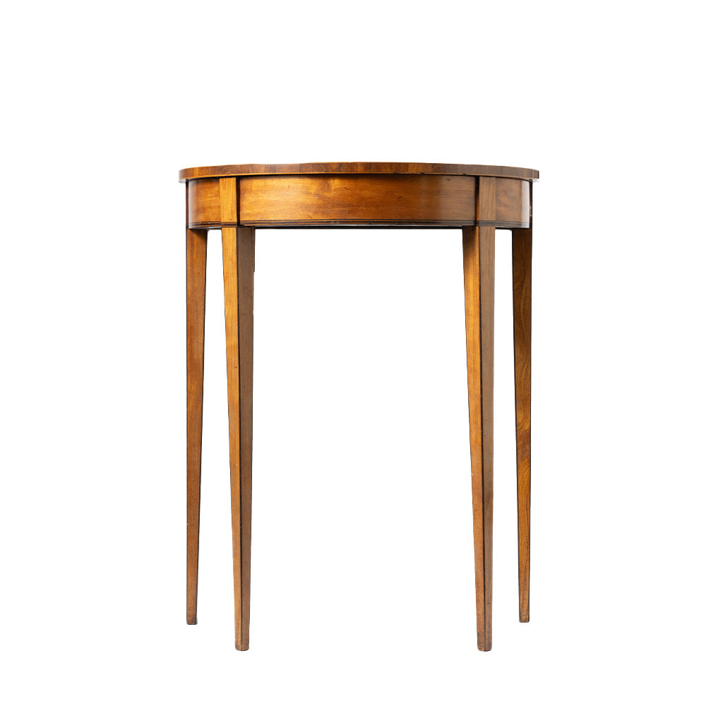 A round wooden console table with a warm medium-brown finish, four tapered legs, shown against a plain white background.
