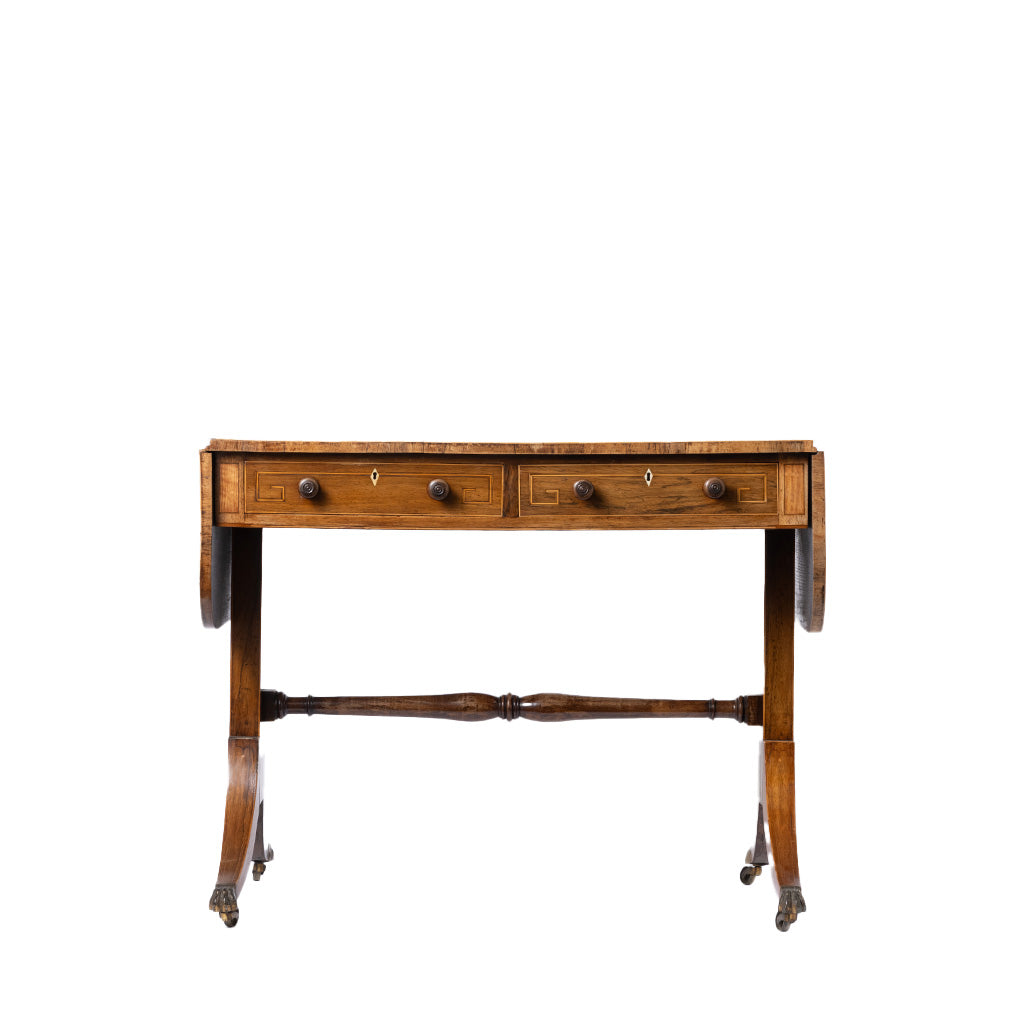 An antique wooden writing desk with two drawers, turned legs, and a central stretcher bar, shown against a plain white background.