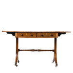 An antique wooden writing desk with two drawers, turned legs, and a central stretcher bar, shown against a plain white background.