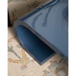 Blue cocktail table on a patterned carpet