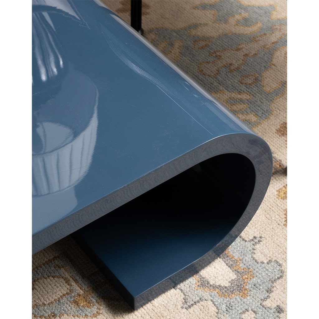 Blue table on a patterned rug