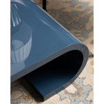 Blue table on a patterned rug