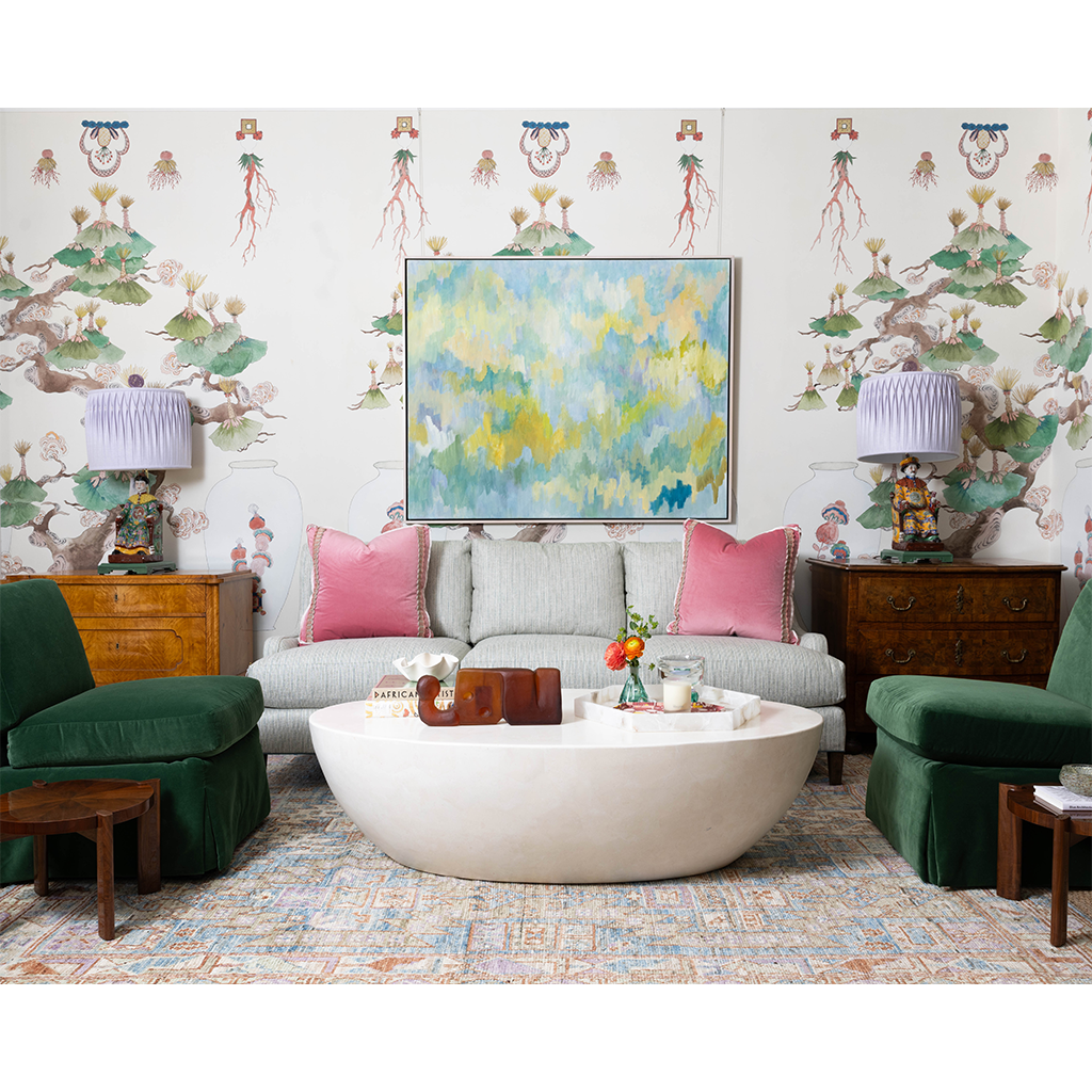 side tables with lamps and green chairs and pale blue couch